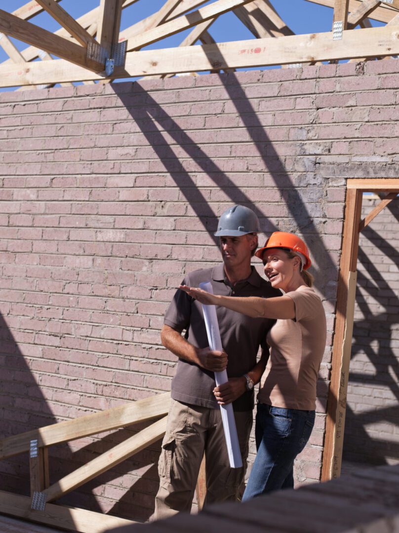 Architects discussing project on site