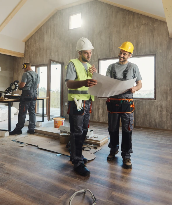 Workers discussing renovation project indoors